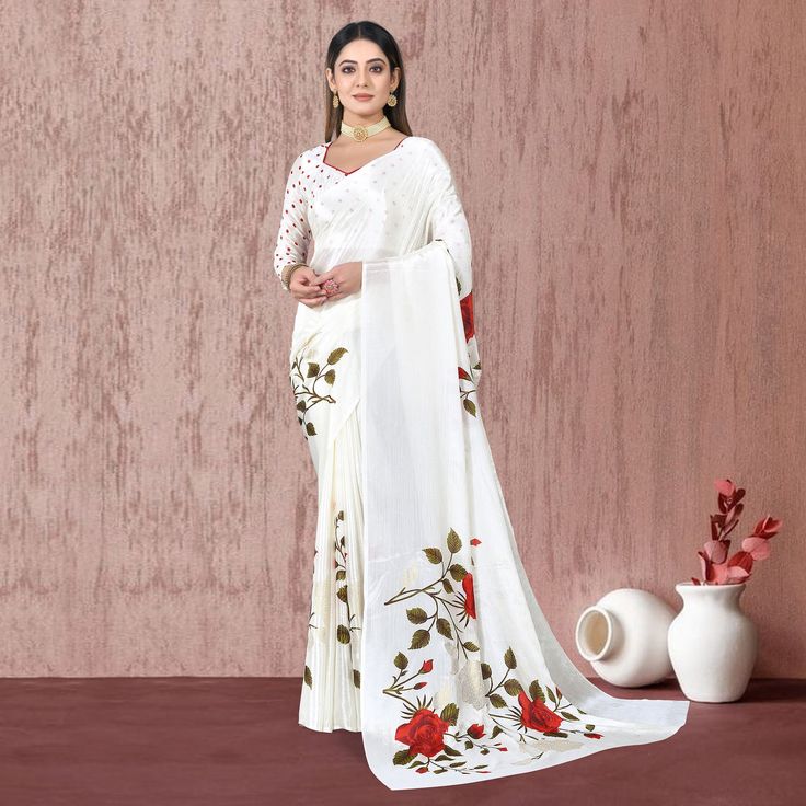 White colored saree is prettified with beautiful floral foil printed work as shown which makes it appear classy. This saree is made of chiffon silk fabric which is accompanied with chiffon blouse piece which you can customise as per your design/style. Women can buy this saree to wear for their parties and functions. Note:- The actual product may differ slightly in color and design from the one illustrated in the images when compared with computer or mobile screen. Measurements: Saree : Chiffon : 5.5 Mtrs Blouse : Chiffon : 0.8 Mtr Material: Chiffon Stitch Type: Unstitched Country of Origin: India Care Guide: Dry Clean Elegant Pre-draped Georgette Saree With Floral Print, Festival Georgette Saree With Printed Motifs, Festive Georgette Saree With Printed Motifs, Elegant Georgette Blouse Piece With Digital Print, Semi-stitched White Saree With Floral Print, Festive Pre-draped Georgette Saree With Digital Print, White Blouse Piece With Printed Border, Elegant Georgette Pre-draped Saree With Floral Print, Elegant Chiffon Blouse For Navratri