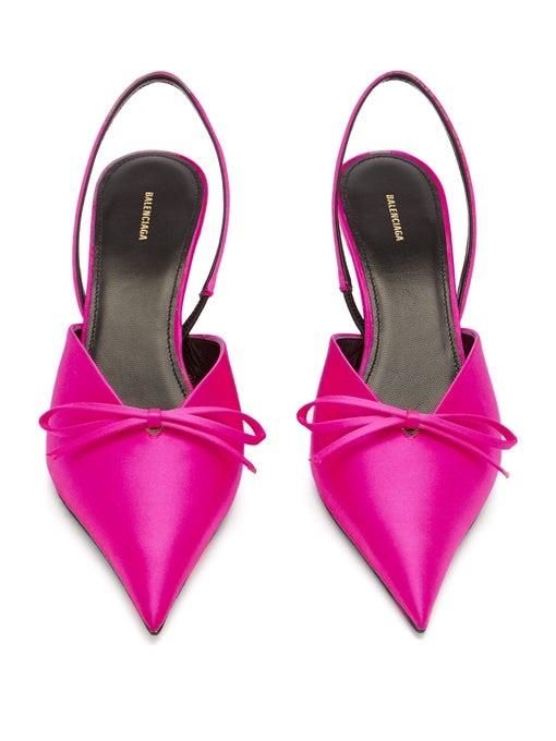 These edgy mules from Balenciaga are the ultimate investment in style. Pink satin combines with the label's subversive runway style to perfection with their kitten heel, bow detail and extreme toe dubbed the knife point. Slip-on, slingback, extreme point toe.Composition and Care: Satin.Heel height: 4cm. Country of Origin: Made in Italy Chic Kitten Heels With Bow Straps For Evening, Pink Pointed Toe Heels With Bow Straps, Modern Kitten Heels With Wrapped Heel For Party, Chic Summer Kitten Heels With Bow Straps, Chic Spring Kitten Heels With Bow Straps, Chic Kitten Heels With Bow And Pointed Toe, Designer Kitten Heels With Pointed Toe, Spring Formal Kitten Heels With Bow Straps, Designer Kitten Heels With Sculpted Pointed Toe