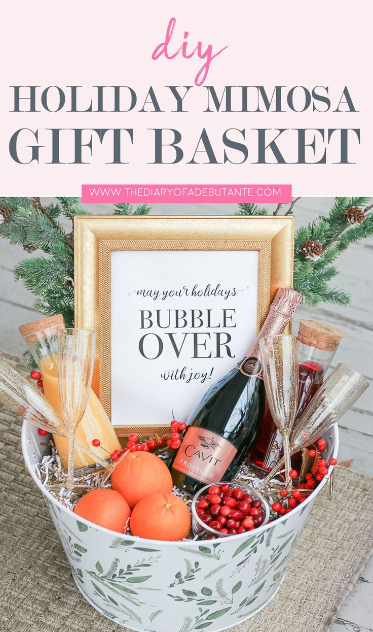 a holiday gift basket with wine, oranges and other items in it that says diy holiday mimosa gift basket