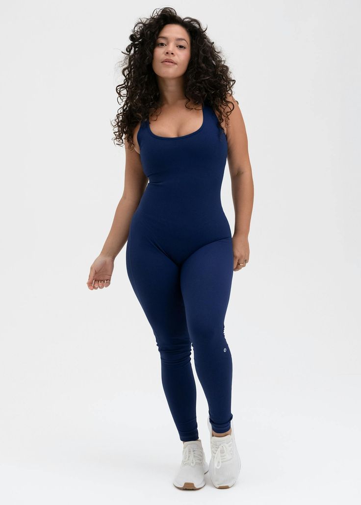 Supportive 4-Way Stretch
27" Inseam
No Front Seam
Scoop Neckline With Low Back
Thick 1" Straps With Built In Bra
Silicon Ethika Script on Back
Rubber Icon on Right Leg
78% Polyester 22% Spandex Fitted Scoop Neck Activewear For Loungewear, Fitted Seamless Activewear With Scoop Neck, Seamless Fitted Activewear With Scoop Neck, Fitted Moisture-wicking Activewear With Scoop Neck, Fitted Blue Seamless Activewear, Fitted Navy Elastane Activewear, Seamless Second-skin Activewear For Yoga, Navy Fitted Yoga Activewear, Blue Stretch Activewear With Scoop Neck