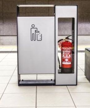 a fire extinguisher sitting in the middle of a tiled floored area