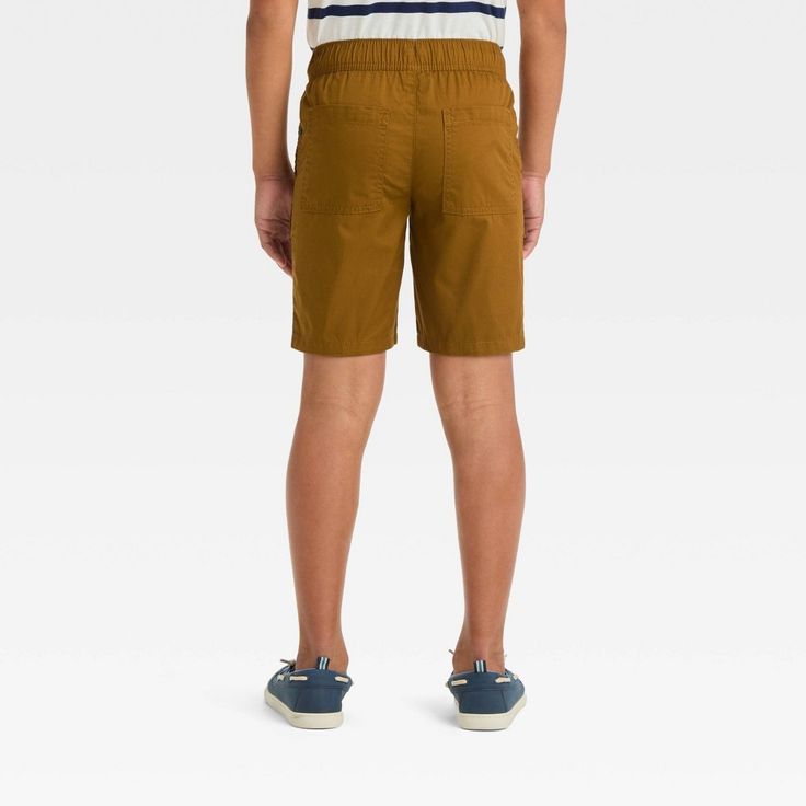 Prepare your young explorer for an adventurous day with these Relaxed 'At the Knee' Pull-On Cargo Shorts from Cat & Jack™. Crafted from 100% cotton blend with comfy lining, these mid-rise shorts offer comfortable all-day wear. The solid-color finish adds a touch of flair to their outfit plus the flexible waistband with a front drawstring ensures a secure fit. Complete with cargo pockets on the legs as well as side and back pockets, these shorts combine stylish design with functional flair. Cat & Casual Bottoms With Pockets For Adventure, Casual Short Bottoms For School, Casual Short Length Bottoms For School, Casual Brown School Bottoms, Casual Brown Bottoms For School, Brown Shorts For Outdoor Activities In Summer, Brown Shorts For Outdoor Summer Activities, Brown Shorts For Summer Outdoor Activities, Brown Casual Hiking Bottoms