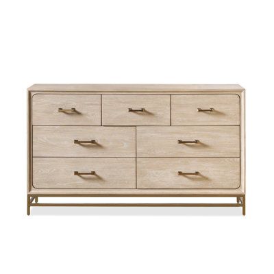 the chest of drawers is made out of wood and has metal handles on each drawer