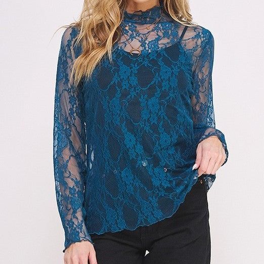 Discover the elegance of our Floral Lace Top, where timeless sophistication meets contemporary design. Crafted from mesh fabric with good stretch, this top ensures a comfortable fit while flattering your figure. Its mock neck adds a touch of refinement, and the floral print lace infuses it with delicate charm. Long sleeves complete the look, making this piece a versatile addition to your wardrobe for a polished yet feminine appeal that seamlessly transitions from day to night. Materials: 88%Poly Spring Lace Mesh Top For Layering, Spring High Neck Mesh Top For Layering, Elegant High Neck Mesh Top For Layering, Spring Turtleneck Mesh Top For Layering, Chic Lace Top For Fall Layering, Sheer Sleeve High Neck Mesh Top For Layering, Sheer High Neck Mesh Top For Layering, Sheer Stretch Lace Top For Layering, High Neck Sheer Mesh Top For Layering