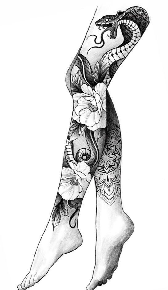 a woman's legs with tattoos and flowers on her leg, in black and white