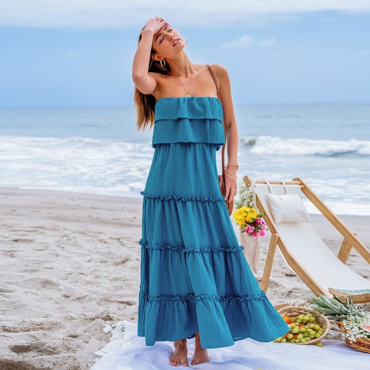 Dance into summer with our Ruffled Tiered Maxi Tube Dress! Featuring cascading tiers of playful ruffles, this dress exudes holiday charm and carefree elegance, perfect for twirling through sunny days and warm nights with style and grace. Whether you're lounging by the pool, exploring a new destination, or attending a casual outdoor event, this versatile piece will keep you looking effortlessly chic and feeling comfortable all day long. Product code: CAA05A4E054TT Bohemian Sundress With Ruffle Hem And Ruffled Straps, Bohemian Sundress With Ruffle Hem And Straps, Beach Season Dress With Ruffled Straps And Details, Sleeveless Ruffled Sundress For Beach Party, Beach Season Dresses With Ruffles And Ruffled Straps, Beach Season Dress With Ruffles And Ruffled Straps, Chic Ruffled Maxi Dress For Vacation, Vacation Dresses With Layered Hem And Tiered Skirt, Vacation Dresses With Layered Tiered Skirt