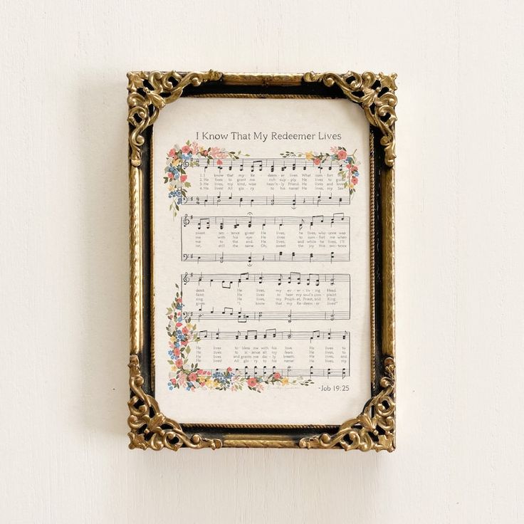 there is a framed sheet with musical notes on it