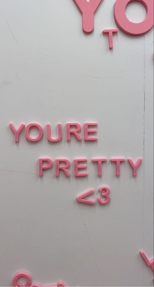 the words you're pretty are written in pink on a white background with small letters