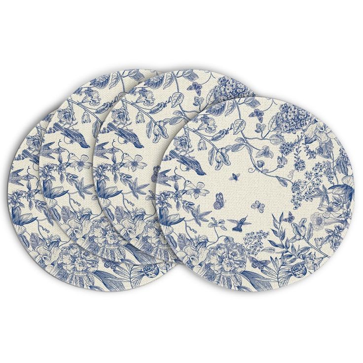 three blue and white plates with floral designs on the front, one has an image of birds