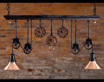 an industrial style light fixture hanging from a brick wall