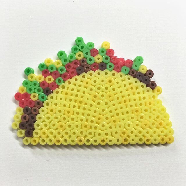 a piece of beaded art made to look like a taco