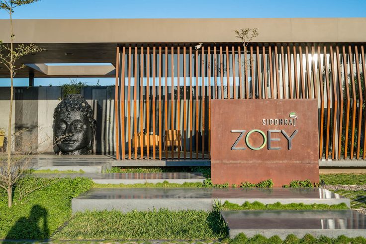 the entrance to an office building with a statue in front of it that says,'sunshine and joy '