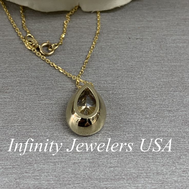 "The pendant pictured is a pear shaped simulated diamond #6884 -Approximate total carat weight: approx. 4.00ctw diamond equivalent -Center Stone Size: 13x9mm - approx. 4.00ct diamond equivalent -Center Stone Shape: pear -Gem Type: simulated diamond -Stone Clarity: VVS1 -Stone Color: D -Moh's Scale: 8.5 hardness -Metal Type and Purity: 14k yellow gold (also shown in 14k white gold) -Setting: bezel set -Chain: delicate 14k gold chain / heavier option with lobster claw available (use dropdown to se Formal Teardrop Bezel Set Jewelry, Pear-shaped Necklace With Bezel Setting For Gift, Pear-shaped Bezel Setting Necklace For Gift, Teardrop Bezel Set Necklace Gift, Classic Teardrop Necklace For Anniversary, Gold Teardrop Jewelry With Bezel Setting, Cubic Zirconia Teardrop Jewelry With Bezel Setting, Teardrop Cubic Zirconia Jewelry With Bezel Setting, Classic Yellow Gold Pear-shaped Drop Necklace