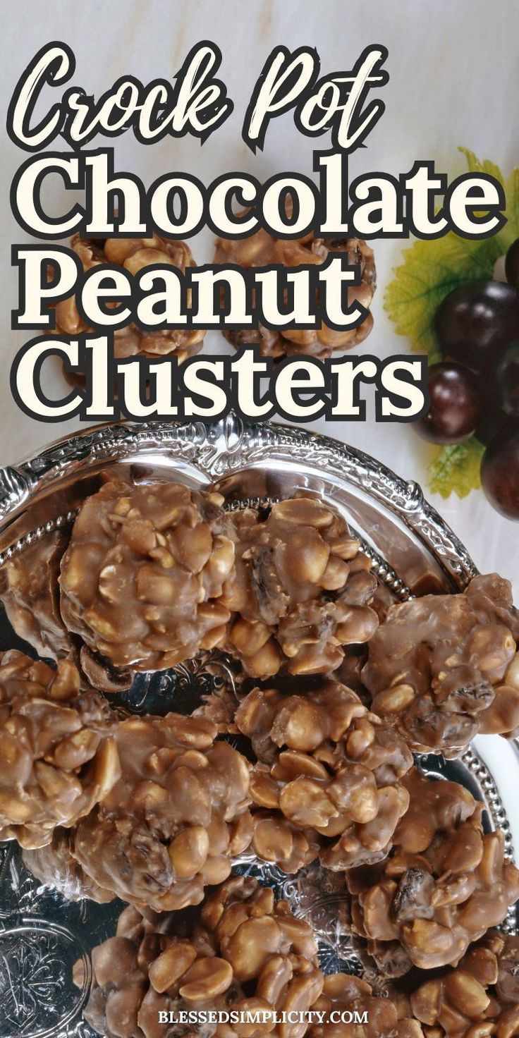 chocolate peanut clusters on a silver platter with grapes in the background and text overlay that reads, crock pot chocolate peanut clusters