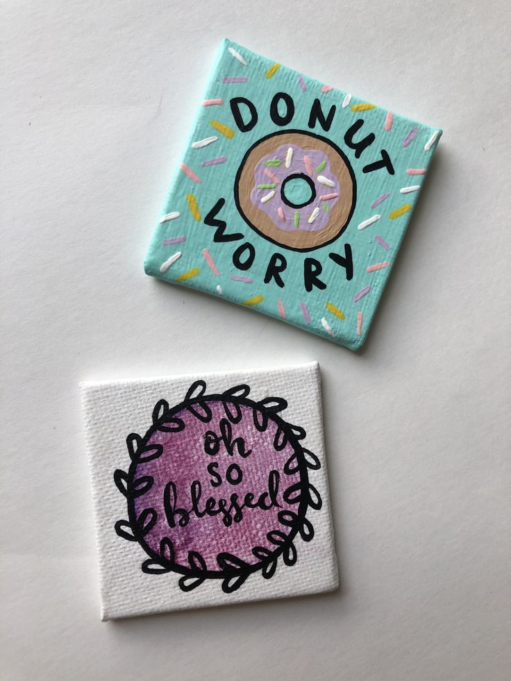 two square magnets with donuts on them and the words donut worry written in black ink