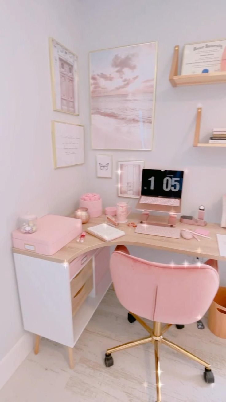 a desk with a laptop computer on top of it in front of pictures and shelves