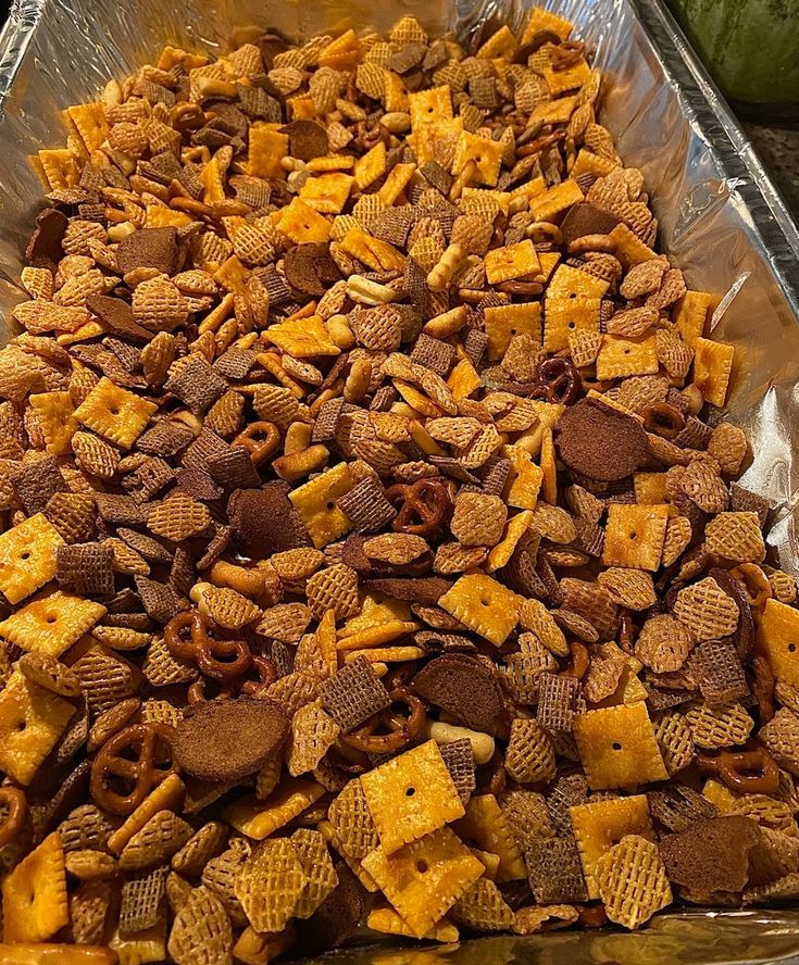 a metal pan filled with cheetos sitting on top of a counter