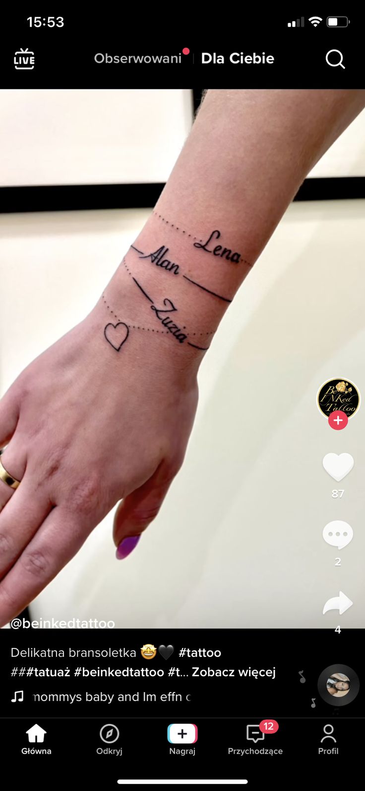 a person's hand with a tattoo on it and the word love written in cursive writing