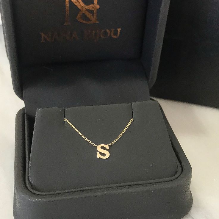 "This little classic initial letter cut-out is composed of 14K solid gold and beautifully complemented by a durable 14K solid gold adjustable chain. ♦ Initial Letter Dimensions: approximately 5mm (w) x 5mm (h) ♦ Metal Finish: High Shine Polish ♦ This design is available in Rose, White and Yellow 14K Gold ♦ Our inventory is limited on Etsy. You can find more quantities and unique designs by vising our website: www.nanabijoujewelry.com ♦ This item is proudly made in USA and also available in 18K s Dainty 14k Gold Initial Necklace For Personalized Gift, Dainty Yellow Gold Initial Necklace For Personalized Gift, 14k White Gold Initial Pendant Necklace, White Gold 14k Initial Pendant Necklace, 14k Gold Initial Pendant Name Necklace For Anniversary, 14k Rose Gold Initials Name Necklace, Personalized Dainty Yellow Gold Initial Necklace, Rose Gold 14k Gold Name Necklace With Initials, Rose Gold 14k Gold Initials Name Necklace