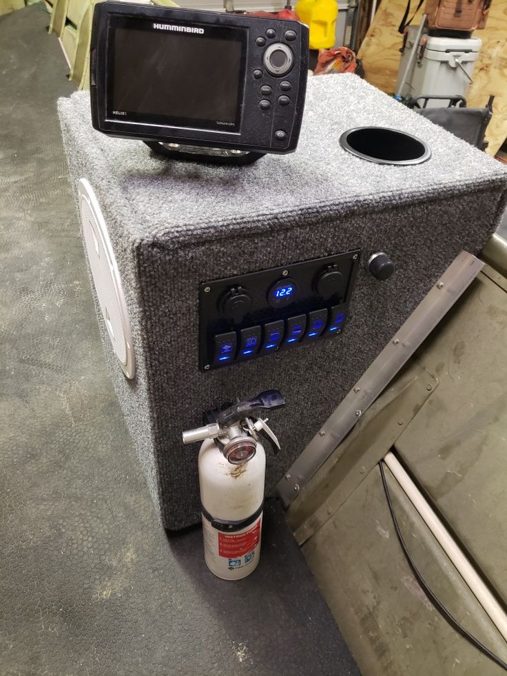 a microwave oven sitting on top of a counter next to a fire extinguisher