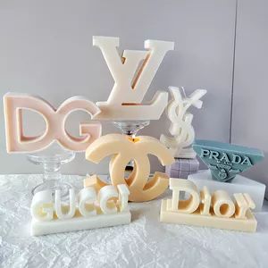 the letters and numbers are made out of fondant, plastic, and paper machings