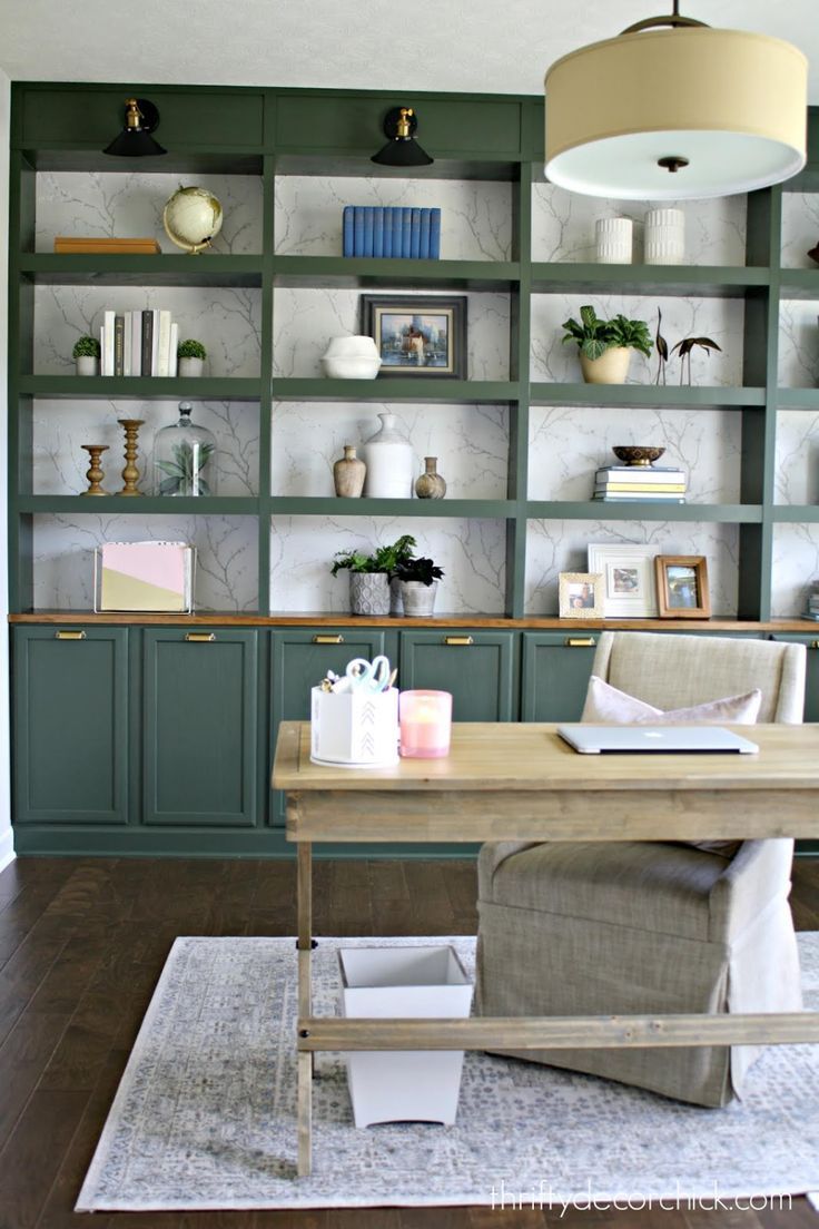 a living room filled with lots of furniture and bookshelves on top of shelves