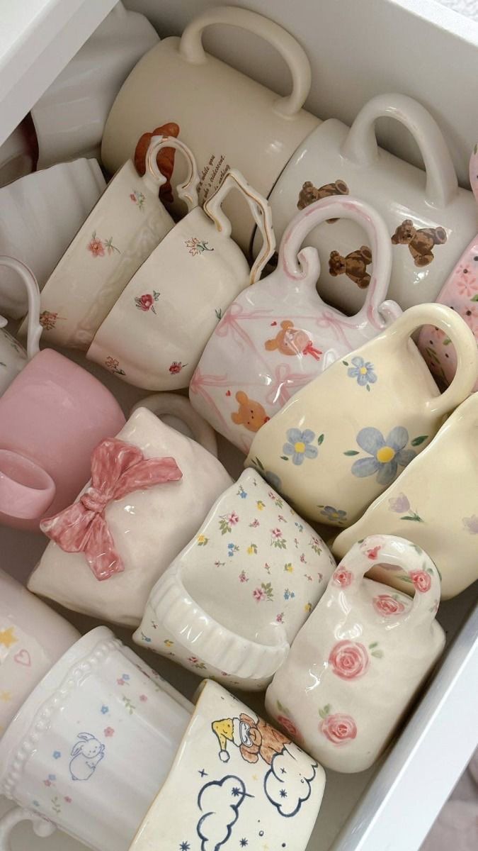 a drawer filled with lots of baby booties and bib's on top of each other