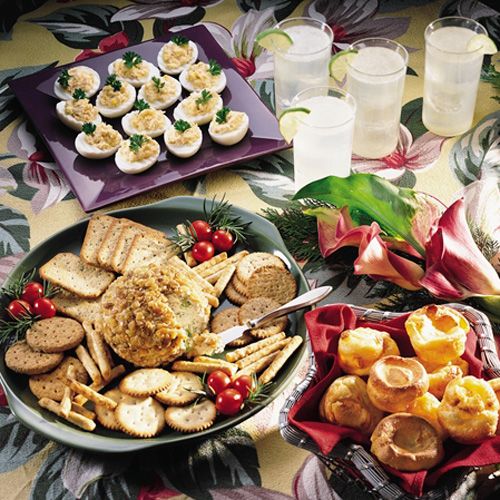 a table topped with plates and bowls filled with food