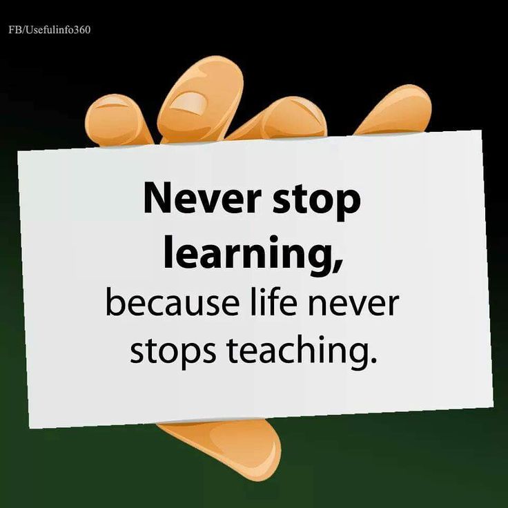 a hand holding a sign that says never stop learning because life never stops teaching,