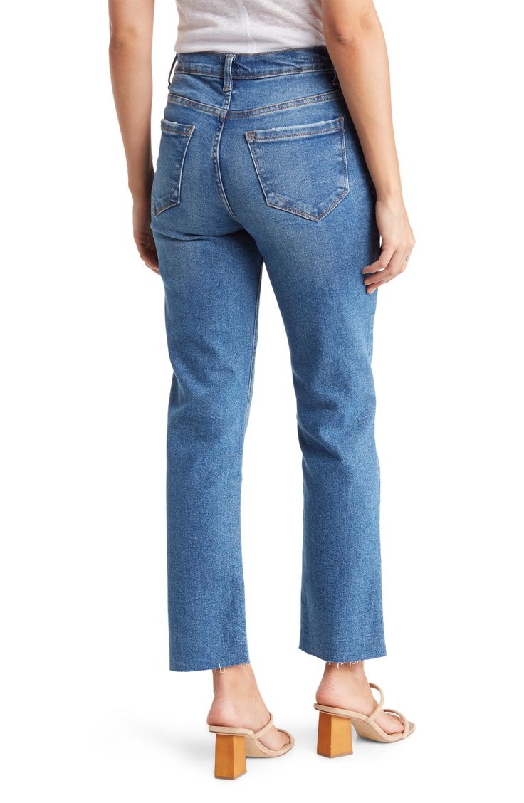 Styled with distressing at the knees and a raw hem, these high-rise jeans are fitted with a straight-leg silhouette for a casual everyday look. 8" rise, 27" inseam (size 26) Zip fly with button closure Five-pocket style High rise Raw hem 68% cotton, 28% polyester, 3% rayon, 1% spandex Machine wash, tumble dry Imported Model stats: 5'10", 32" bust, 25" waist, 36" hip. Model is wearing size 26. Slim Leg, Casual Everyday, Slim Waist, High Rise Jeans, Slim Jeans, Slim Legs, Everyday Look, Straight Leg Jeans, Leg Jeans