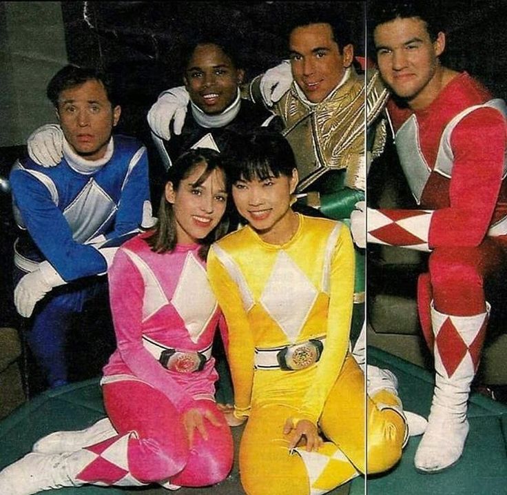 the group of people are posing for a photo in their colorful outfits and costumes that look like they're from the 80s or 90's