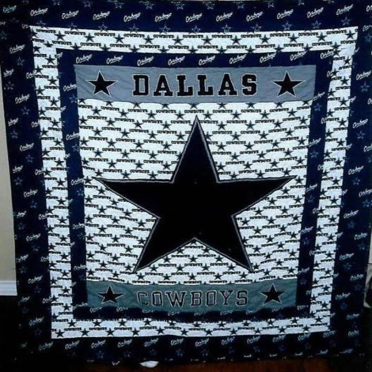 a black and white quilted blanket with the word dallas written in stars on it