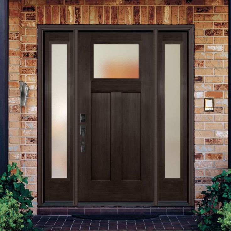 Bring the beautiful look of wood and the performance of fiberglass to your home with the Masonite Fiberglass Entry Door. Engineered to last a lifetime, these high-performance surface doors feature high-definition profiles for added architectural interest. Designed with an energy saving polyurethane door core, the maintenance-free proprietary fiberglass construction provides maximum protection and durability. Masonite 64-in x 80-in x 4-9/16-in Fiberglass Craftsman Right-Hand Inswing Walnut Staine Wood Entry Door With Sidelights, Modern Farmhouse Entry Door, Craftsman Front Door Ideas, Entryway Doors Exterior, Front Door With Side Windows, Front Doors With Sidelights, Residential Front Doors, Craftsman Style Front Doors, Door Core