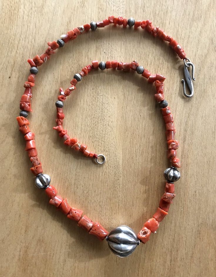 This exquisite coral and sterling silver beaded necklace is finished with an easy to clasp oversize sterling silver S -hook. 25 inch Artisan Beaded Necklaces With Sterling Silver Clasp, Bohemian Beaded Necklace With Sterling Silver Clasp, Silver Beaded Jewelry With Red Coral, Silver Jewelry With Beaded Red Coral, Artisan Coral Jewelry With Round Beads, Artisan Sterling Silver Necklace With Large Beads, Unique Sterling Silver Necklaces With Large Beads, Unique Sterling Silver Necklace With Large Beads, Unique Large Beads Red Coral Jewelry