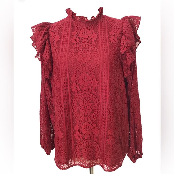 This Beautiful Entro Blouse In Cranberry Salsa Color Is A Must-Have Addition To Your Wardrobe. The High Neck And Button Closure Make It Perfect For Any Occasion, Whether It's A Party, Work, Or Casual Wear. The Lace Fabric With Ruffle Details Adds A Touch Of Elegance To The Blouse. The Blouse Is Available In Size Small And Is Suitable For Women Who Love Colorful Themes. Semi Sheer Sleeves With Elastic Cuffs Keyhole Neckline Lined Length: 25” Pit To Pit: 20” New With Tags (29) Red Ruffled Feminine Tops, Red Feminine Ruffled Tops, Red Ruffled Tops For Brunch, Red Feminine Ruffle Top, Red Ruffle Tops For Brunch, Feminine Red Ruffled Tops, Elegant Red Ruffled Blouse, Red Ruffled Blouse For Fall, Chic Red Blouse With Ruffles