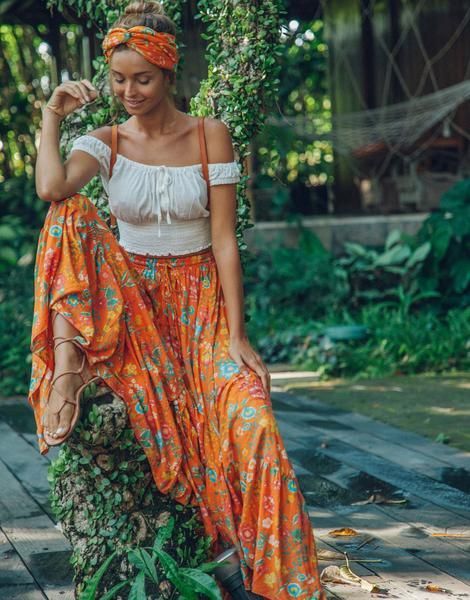 Channel your inner bohemian goddess in the Florence Maxi Skirt in lust-worthy colour of the moment, Orange Blossom. This full-bodied skirt is finished with a flirty flounce and asymmetrical hemline which combines with the button down front detailing to epitomise 70s hippie-chic style. With an elasticised waist band and string tie for a comfortable fit, the Florence Maxi Skirt pairs perfectly with our Effy Knot Top… shoes and festival ticket, optional! Product Details Maxi Adjustable tie Frill Stile Hippie Chic, Bohemian Schick, Looks Hippie, Look Hippie Chic, Beautiful Boho Dresses, 00s Mode, Hippie Chic Fashion, Boho Mode, Estilo Hippy