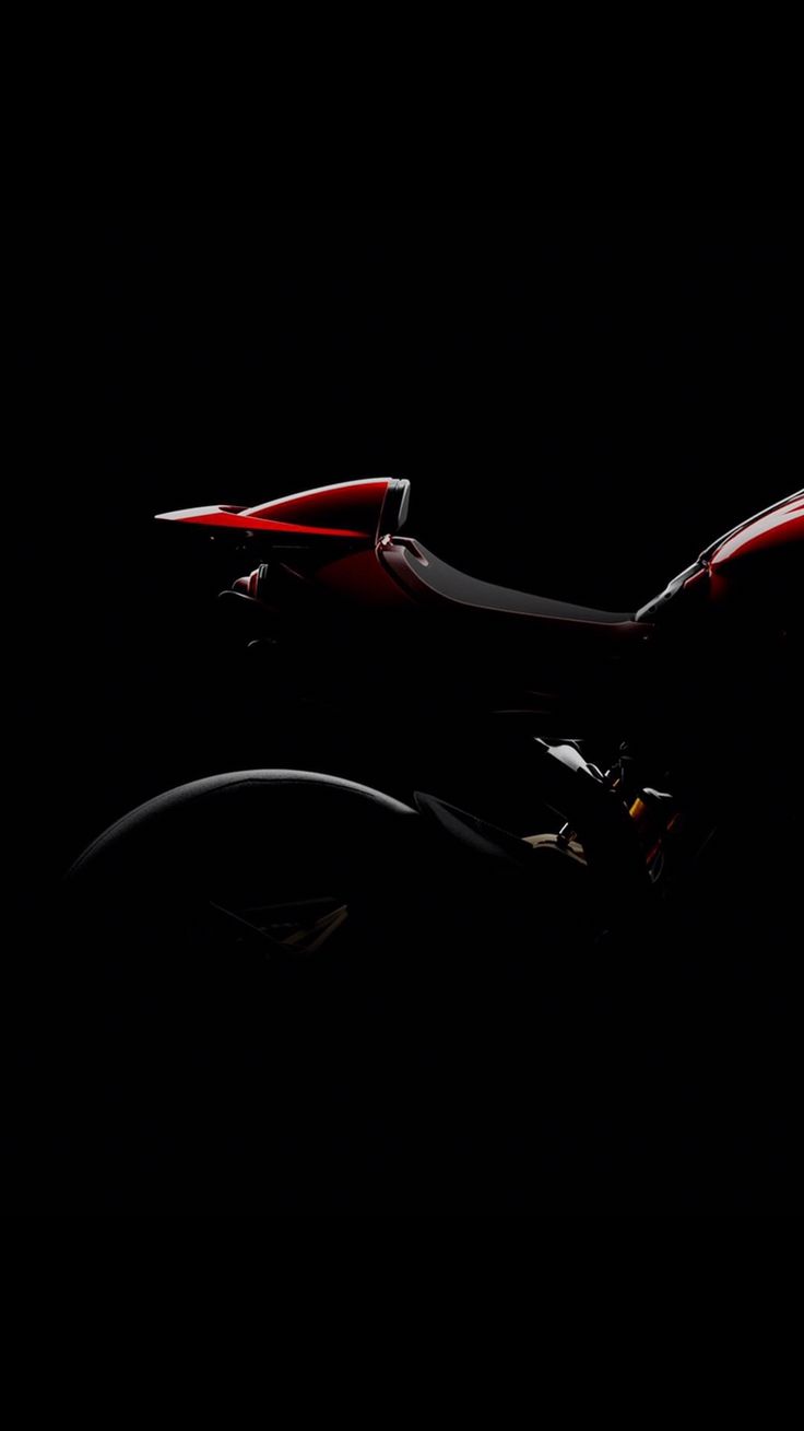 a black and red bike in the dark