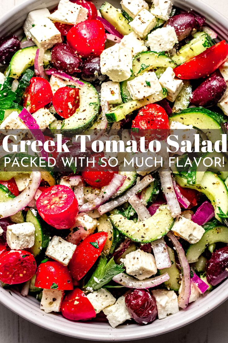 greek tomato salad with cucumber, red onion, and feta cheese in a bowl