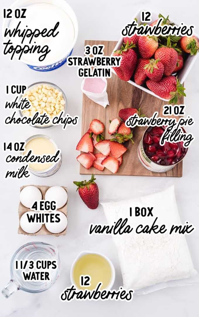 the ingredients to make strawberry shortcakes on a cutting board, including strawberries