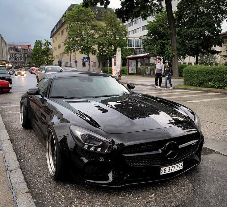 a black sports car parked on the side of the road