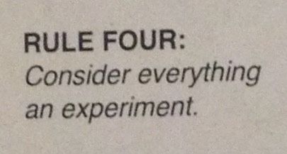 a close up of a piece of paper with the words rules four consider everything an experiment