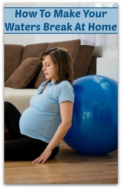 a pregnant woman sitting on top of a blue ball