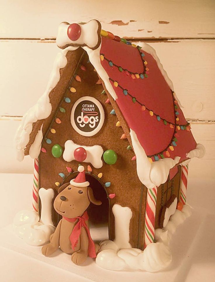 a gingerbread house decorated with candy and icing