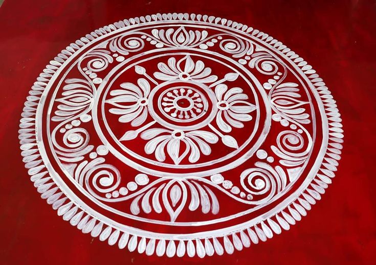 a red table with white designs on it