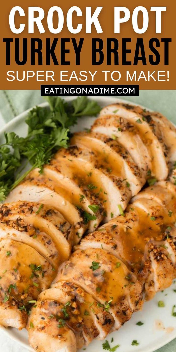 a white plate topped with sliced chicken covered in gravy