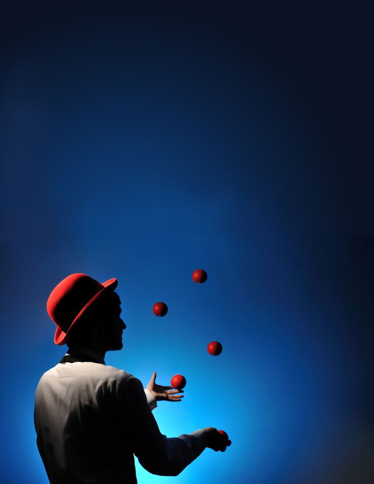 a man juggling balls in the air