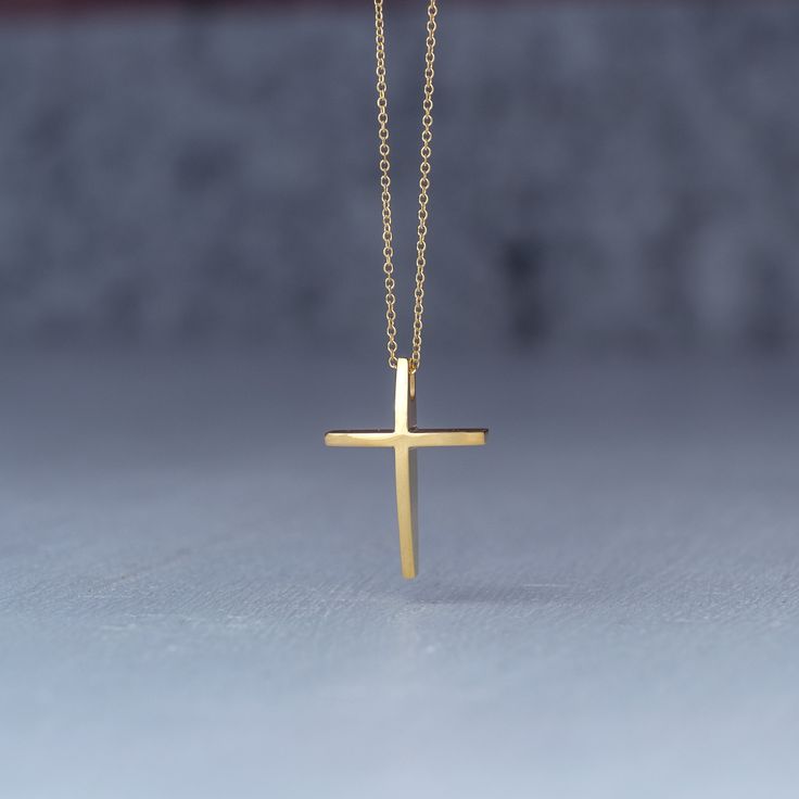 Minimal solid gold handmade cross necklace, curved 14k solid gold cross pendant. This is a beautiful handmade minimal cross with a curved front that makes it a bit different and unique. Available in 14k yellow and 14k white gold , please make your choice from the drop down menu. Minimal cross necklace, unisex pendant. Size: 1,7 cm / 0.7 inches long and 0.7 cm / 0,3 inches wide Material: 14k solid yellow gold or 14k solid white gold You can choose the charm with a yellow gold filled chain (white Minimalist Cross Pendant Necklace As Gift, Minimalist Yellow Gold Cross Pendant Necklace, Minimalist 14k Gold Cross Necklace As Gift, Minimalist Cross Pendant Necklace For Gift, Minimalist Cross Necklace Gift, Minimalist Gold Cross Necklace As Gift, Minimalist Yellow Gold Cross Necklace Gift, Minimalist Crucifix Necklace As A Gift, Minimalist Crucifix Necklace For Gift