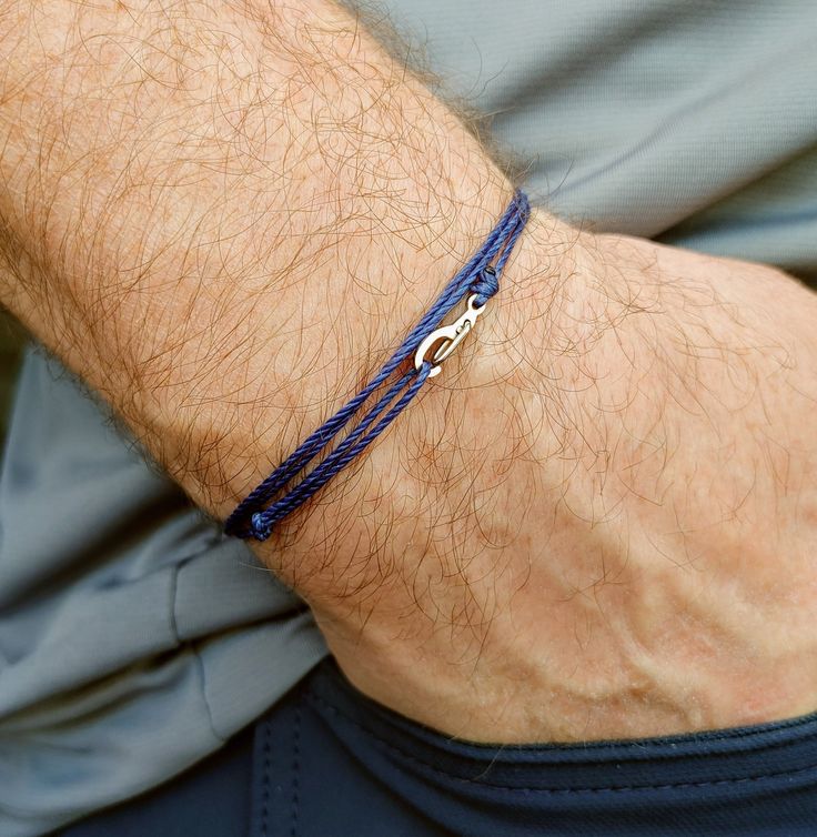 "A simple and minimalist waterproof navy blue string bracelet for men or women.  It wraps three times around the wrist or ankle and closes with a small metal hook. Cord - the cord is a high quality, long lasting waxed polyester cord that will hold up all well to  all your daily activities and to the elements.  You can wear this in the shower, to the office  and even when you are hiking, biking, surfing etc.  This cord wears very well and will remain a true blue color even with continuous wear. C Mens Minimalist Bracelet, Sea Glass Crafts Jewellery, Surf Bracelets, Ocean Bracelet, Bracelets Men, Surfer Bracelets, Diy For Men, Bracelet Minimalist, Diy Bracelets Easy