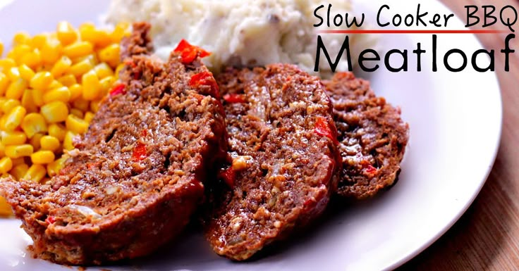 a white plate topped with meatloaf, corn and mashed potatoes