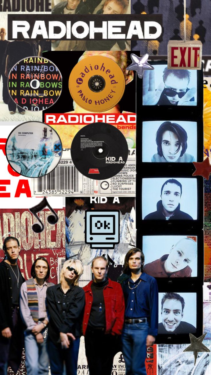 a group of people standing next to each other in front of a wall with various records on it